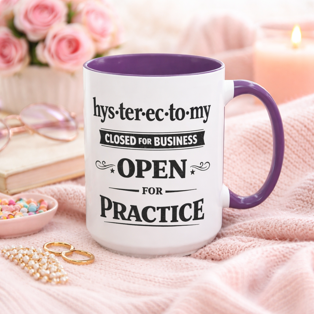 White ceramic coffee mug with a black handle and rim displaying the phrase “Hysterectomy Closed for Business Open for Practice” in a distressed vintage-style font.
