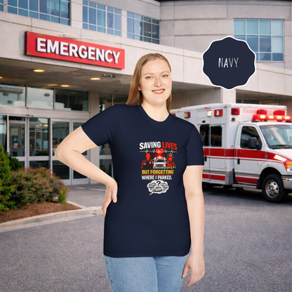 Woan wearing Saving Lives But Forgetting Where I Parked nurse humor shirt standing outside hospital emergency entrance